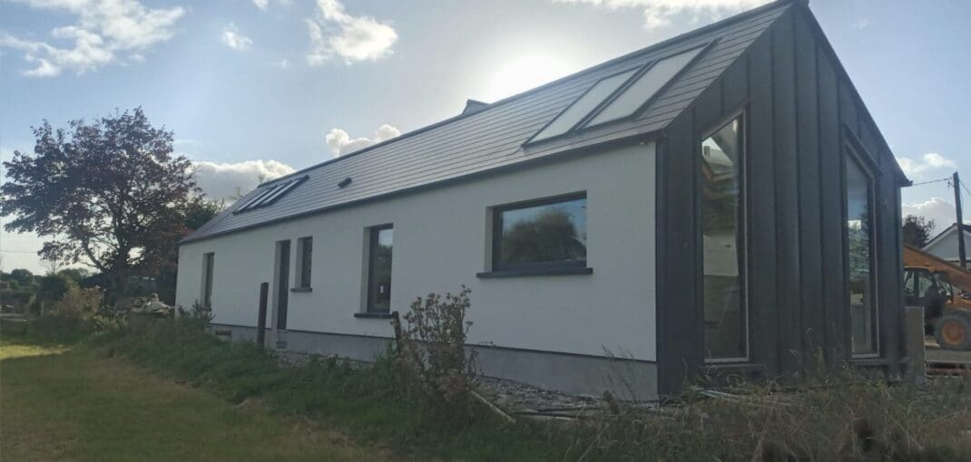 Shanette Steel Frame house extension with Standing Seam Gable end.