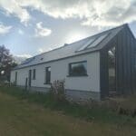 Shanette Steel Frame house extension with Standing Seam Gable end.