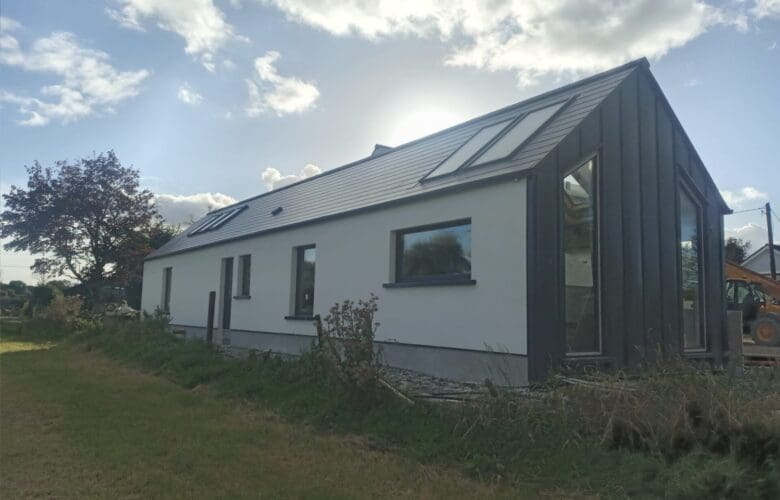 Shanette Steel Frame house extension with Standing Seam Gable end.