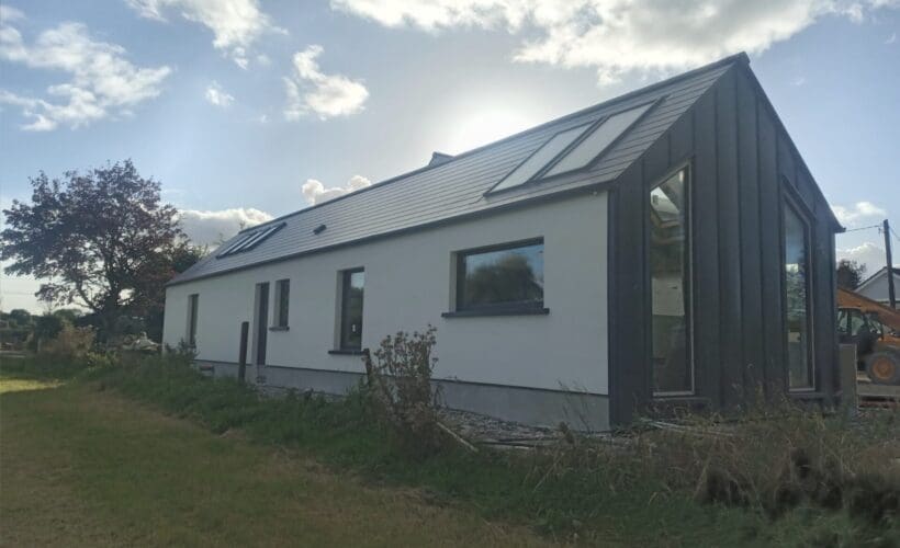 Shanette Steel Frame house extension with Standing Seam Gable end.